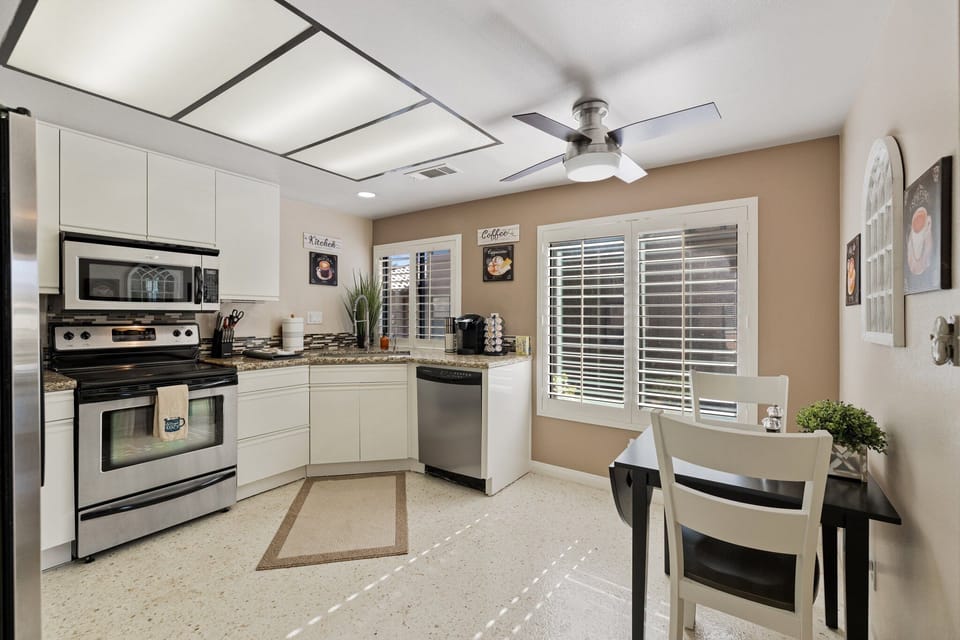 Kitchen: stocked with cookware, dishware, glassware and silverware