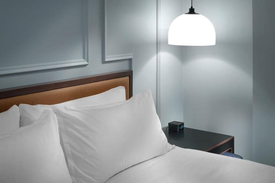 Sink into plush pillows under soft pendant lighting.