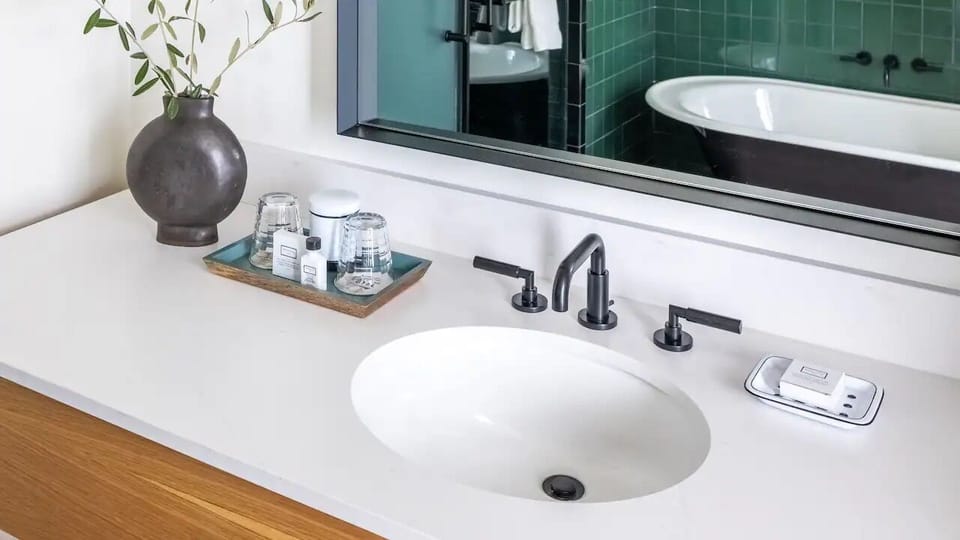 Refresh at the sleek vanity, then soak in the deep tub.