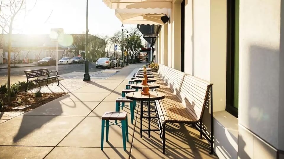 Sip morning coffee streetside and watch the neighborhood wake up.