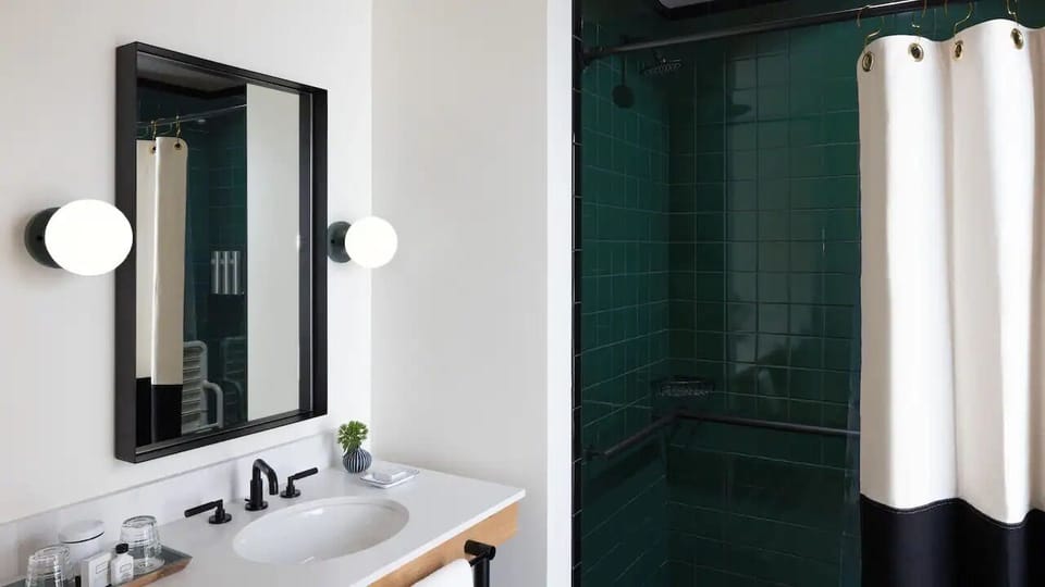 Refresh effortlessly with a sleek vanity and modern shower.