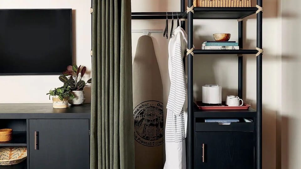 Settle in easily with open storage and convenient in-room coffee.
