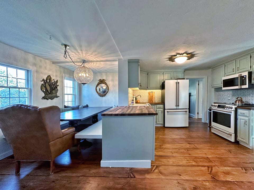 View of open kitchen/custom dining space. dining for 8 people