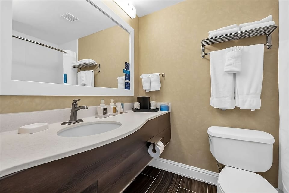 Refresh easily with a clean vanity and plush towels.