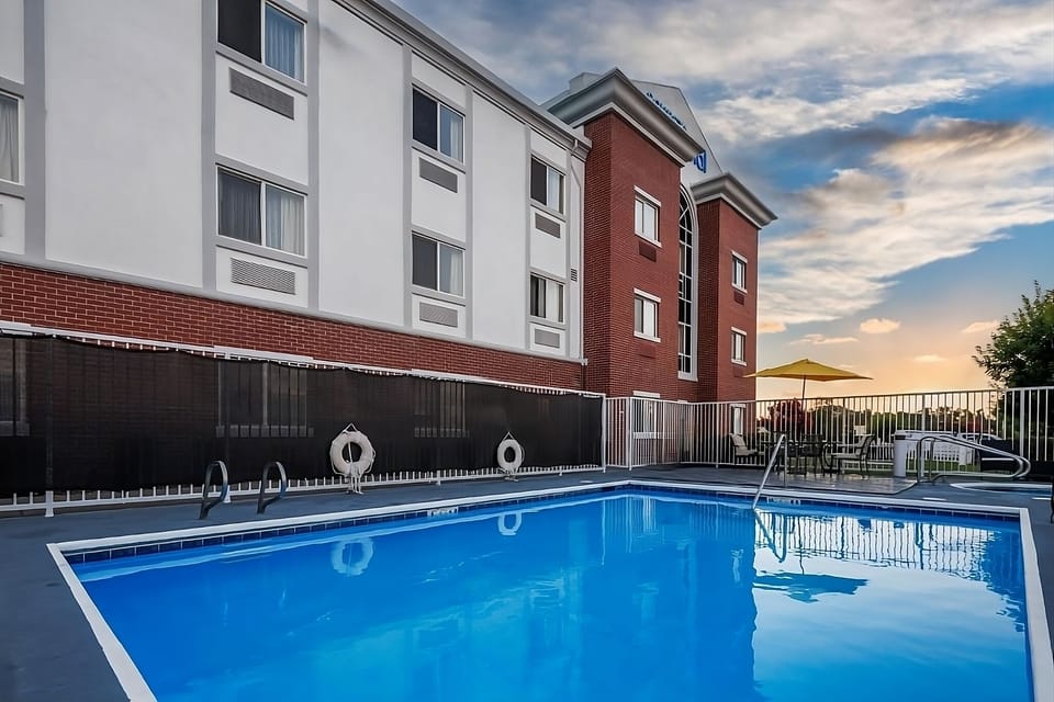 Unwind poolside at sunset with a calming evening dip.