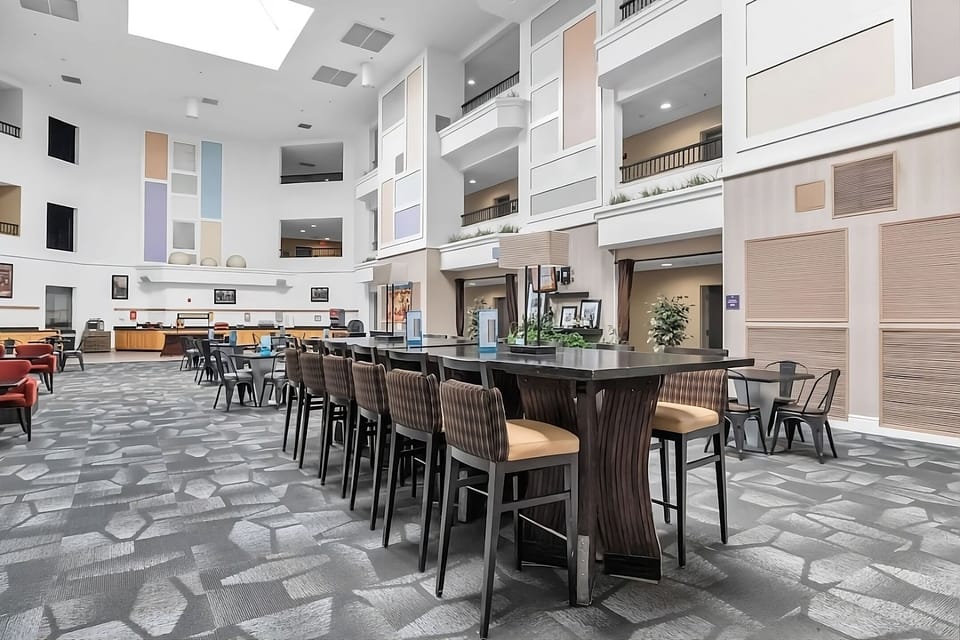 Settle in with spacious lobby seating under soaring ceilings.