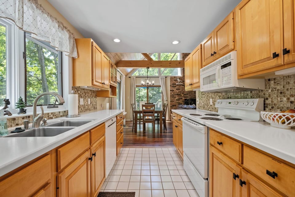 Kitchen from Main Entrance. Small appliances, utensils & supplies are labeled 