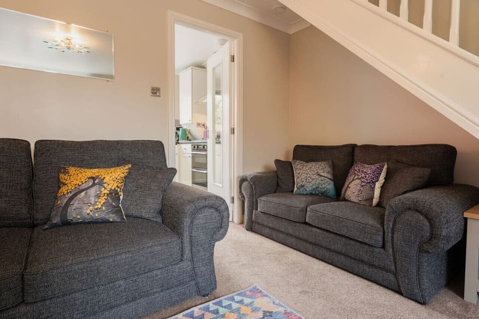 The Living Room: Cosy up on the comfortable sofas in the light & airy living room space.