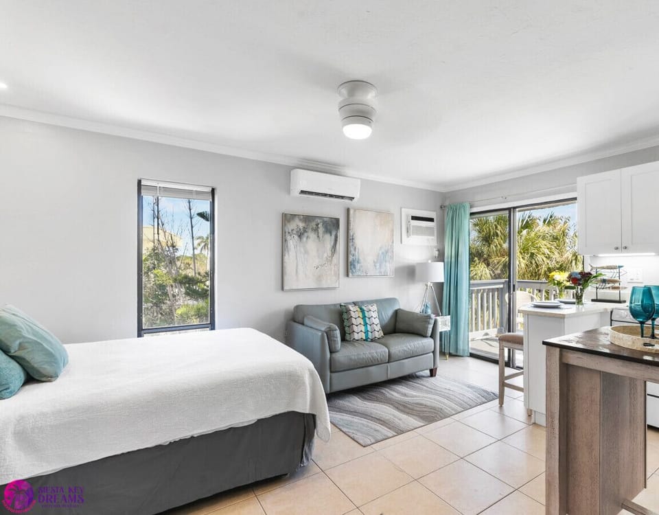 Queen bed, couch, ceiling fan, a/c, & private balcony