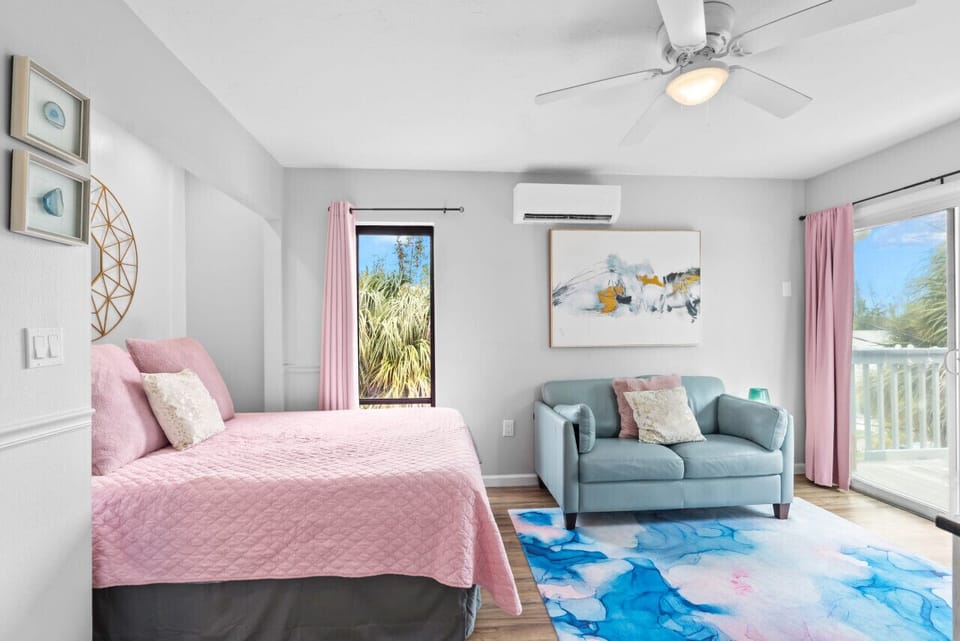 Queen bed, loveseat, private balcony, HDTV, & A/C