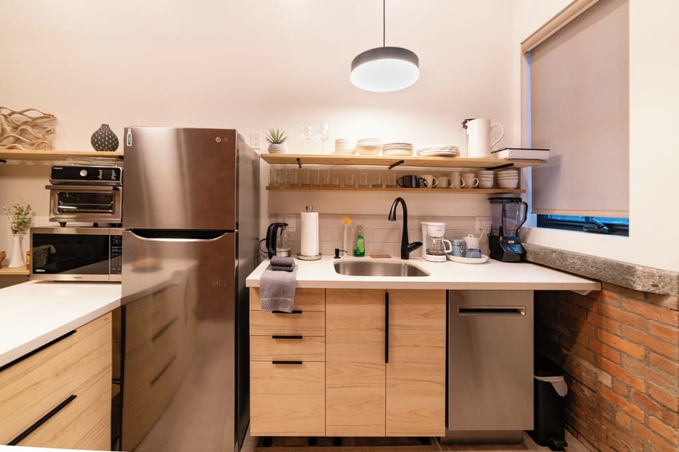 More than a kitchenette... this Kitchen provides fridge, dishwasher, microwave, infrared cook top, and Cuisinart air fryer, toaster, oven that can cook a 12" pizza.