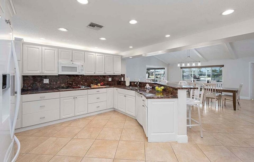 Large Kitchen with Views of Dining Space and Pool