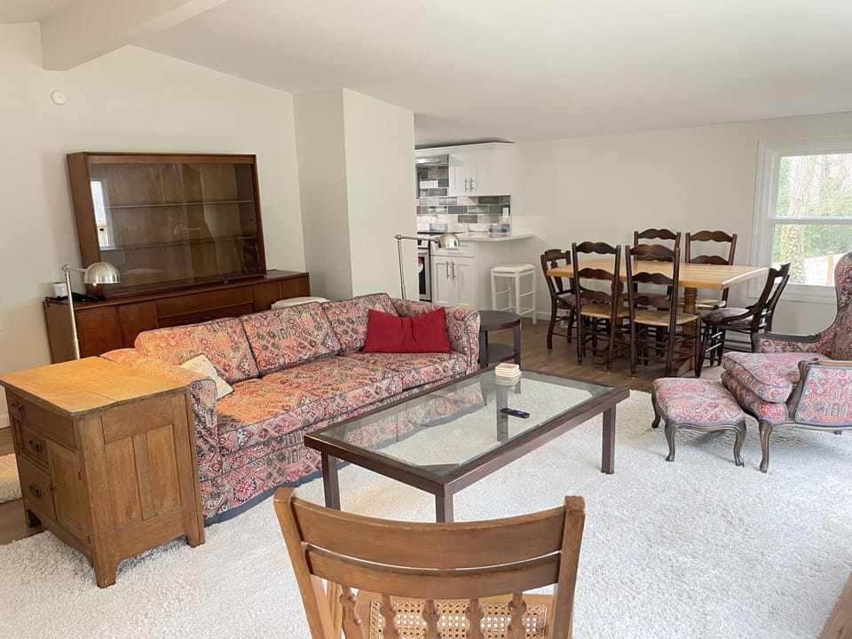 The open floorplan includes living, dining, kitchen.