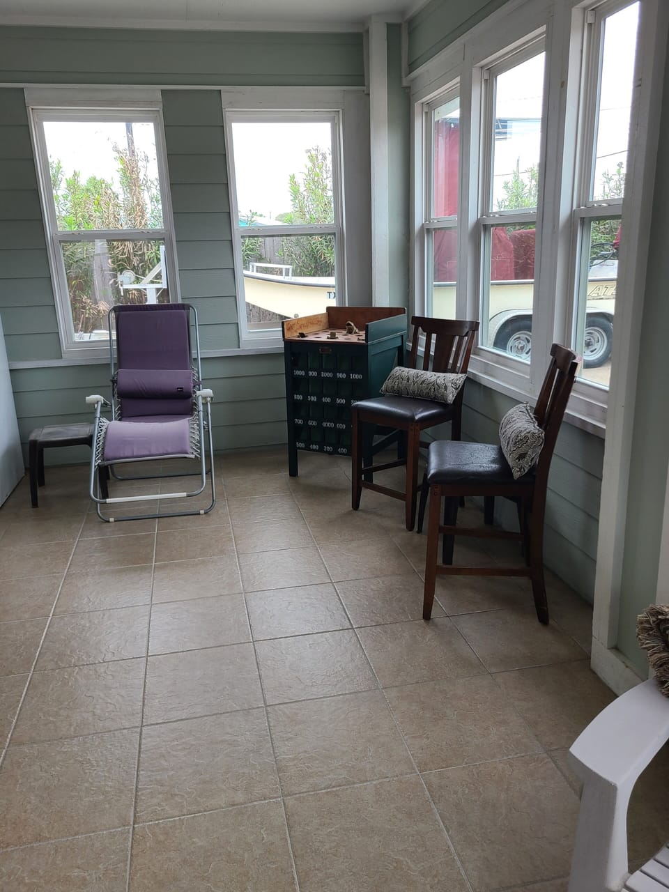 Enclosed Patio with games and plenty of seating, now with Air Conditioning.