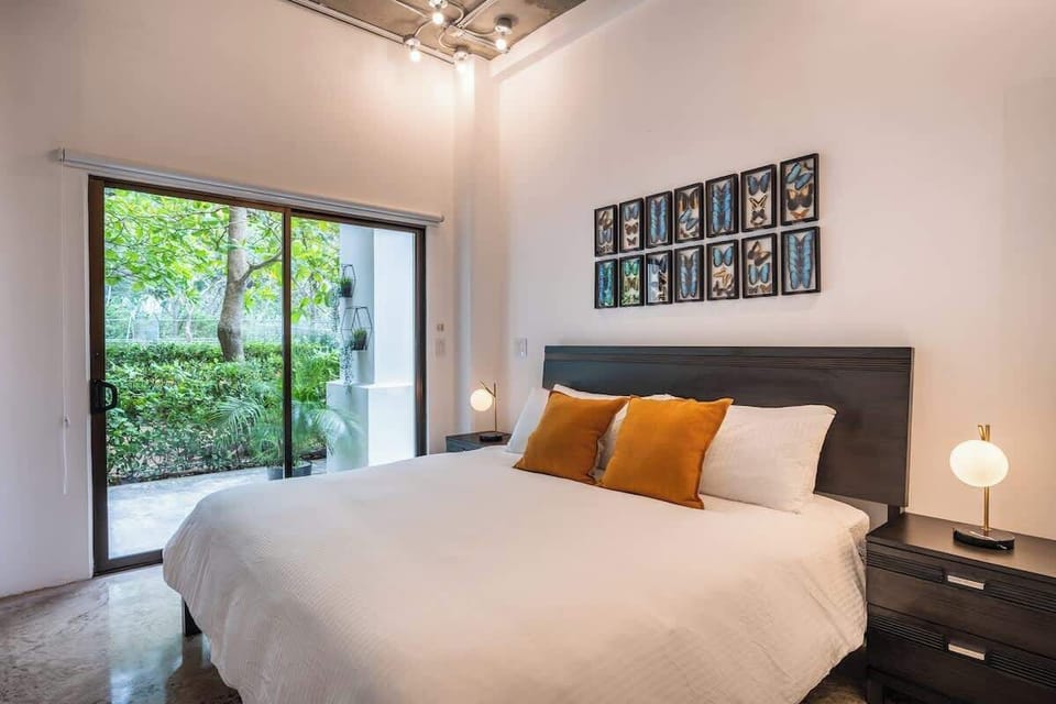 Master Bedroom with walking closet, A/C, Ceiling Fan, Dedicated Work Space and Access to Private Back Patio.