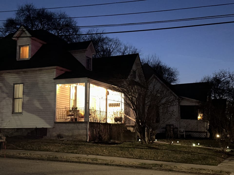 View from the side street toward the porch