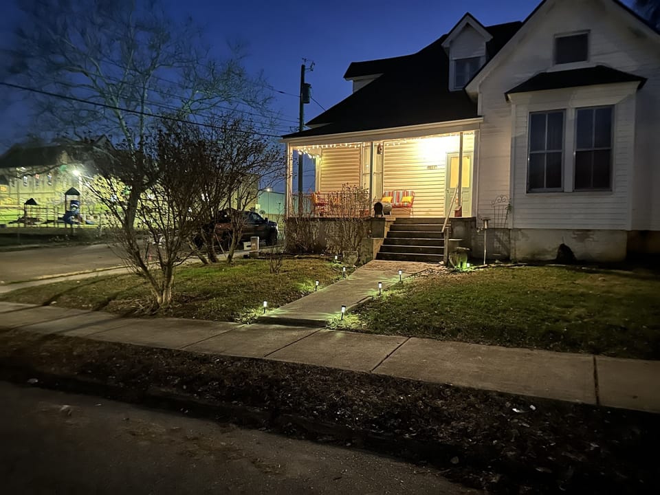 Your entrance lit up with the Lutheran church yard across the street
