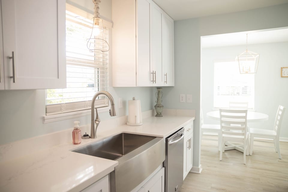 Kitchen has deep large sink & dishwasher