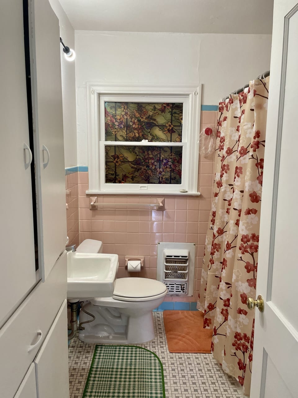 Plenty of storage in the pink bathroom