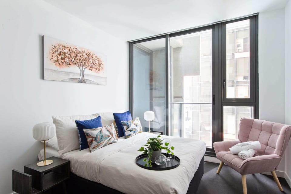 The 2nd bedroom with a double bed & plush pillows.