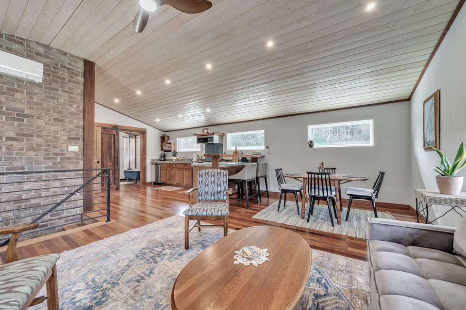 Living space is open to the kitchen and dining and offers an additional queen size bed.