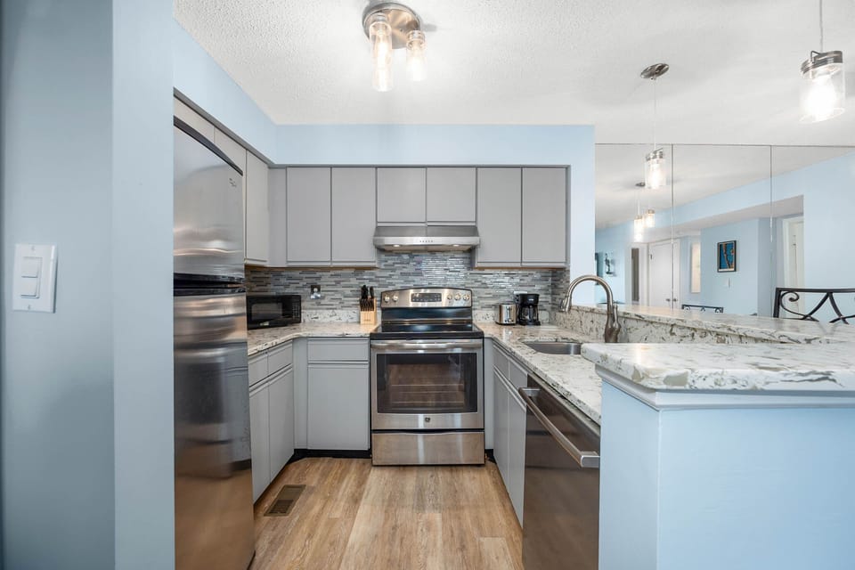 Full kitchen with oven, stove, refrigerator, dishwasher