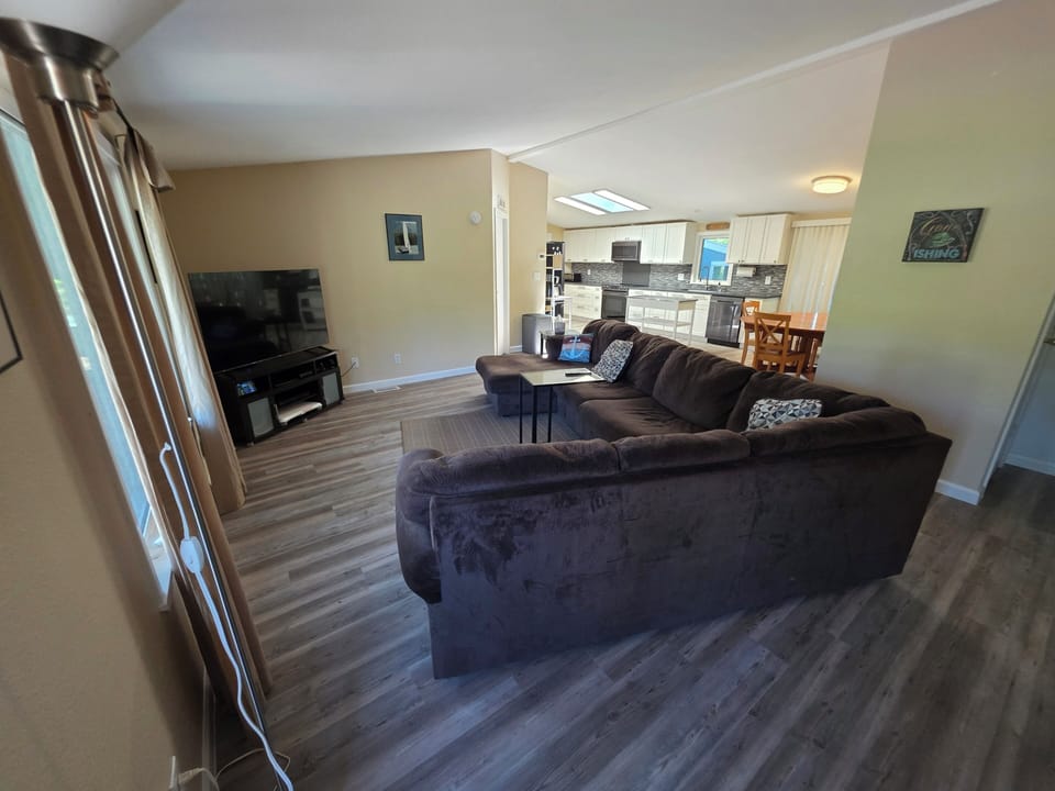 Living room and open concept dining and kitchen space.