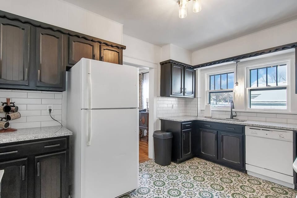 Kitchen with plenty of counterspace and storage, dishwasher, fridge and range.