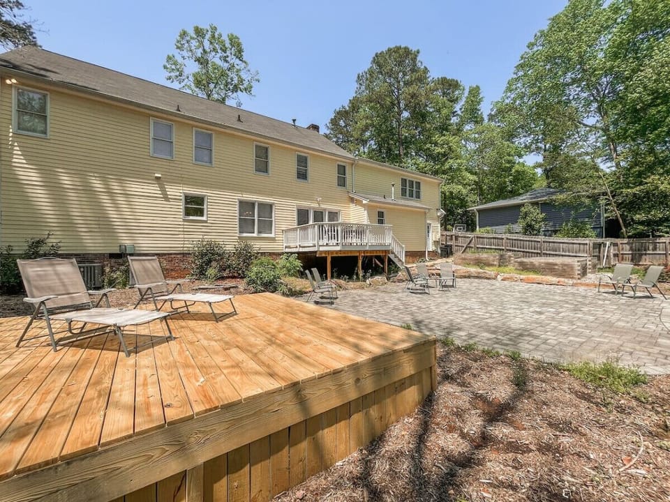 Backyard with spacious patio, and deck. Great for entertaining/family reunions.