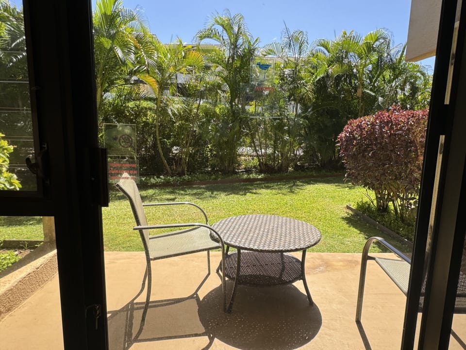 Grassy back yard and lanai
