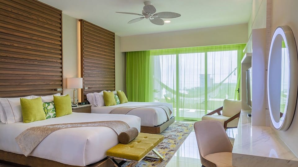 Ocean-view room at Garza Blanca, private balcony, sleek design.