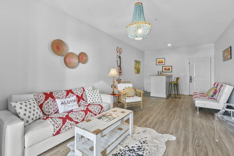 Spacious and serene, the living area in King Suite 302 features elegant furnishings and plenty of room to relax or entertain.
