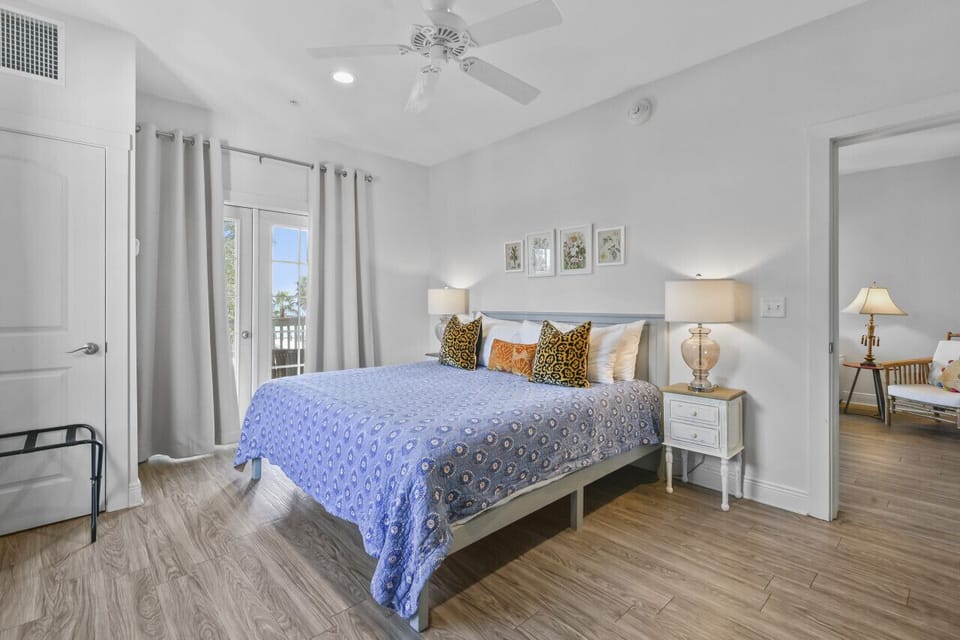 This spacious suite blends comfort and charm, with a plush king bed, thoughtful touches, and easy access to the suite’s stylish living area.