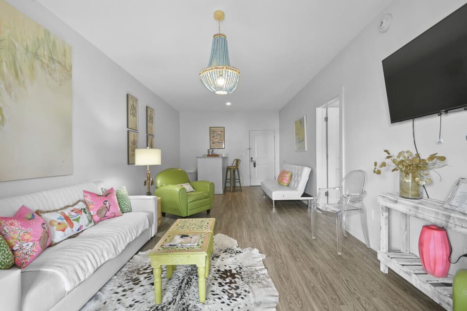 Spacious and stylish, the living area in King Suite 202 is ideal for unwinding after a day by the water or exploring downtown Pass Christian.