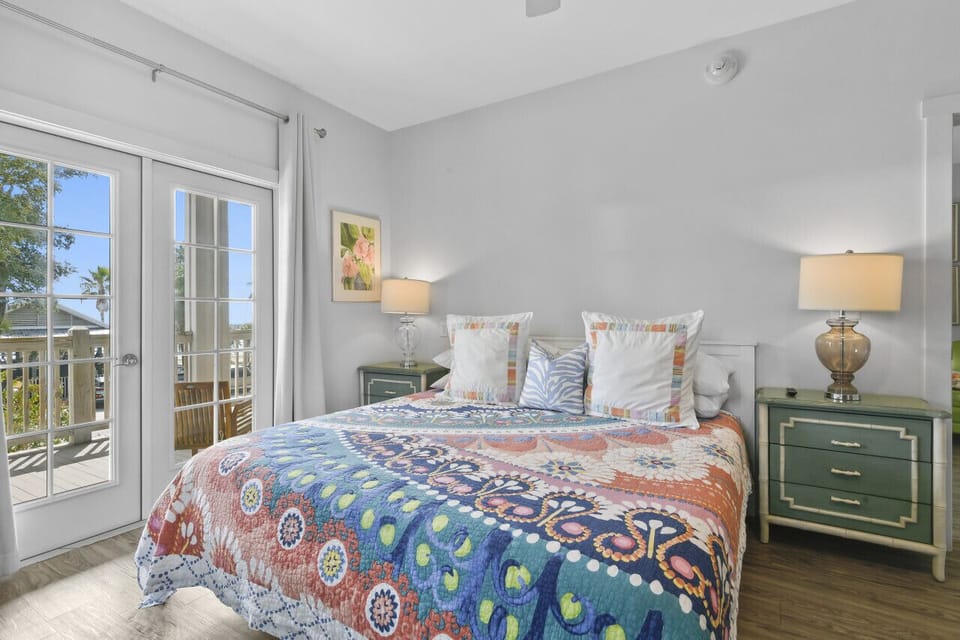 This spacious suite blends comfort and charm, with a plush king bed, thoughtful touches, and easy access to the suite’s stylish living area.