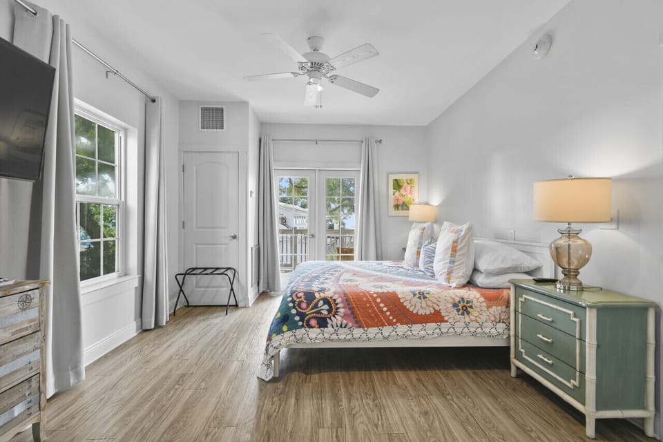 Sleep soundly in a plush king bed surrounded by soft tones, coastal textures, and relaxing natural light.