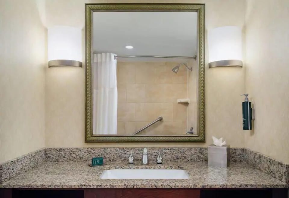 Refresh under a soothing shower with a wide vanity.
