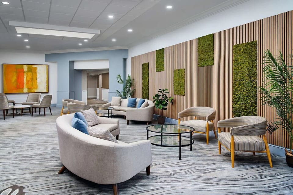 Recharge in the modern lobby lounge with cozy seating.