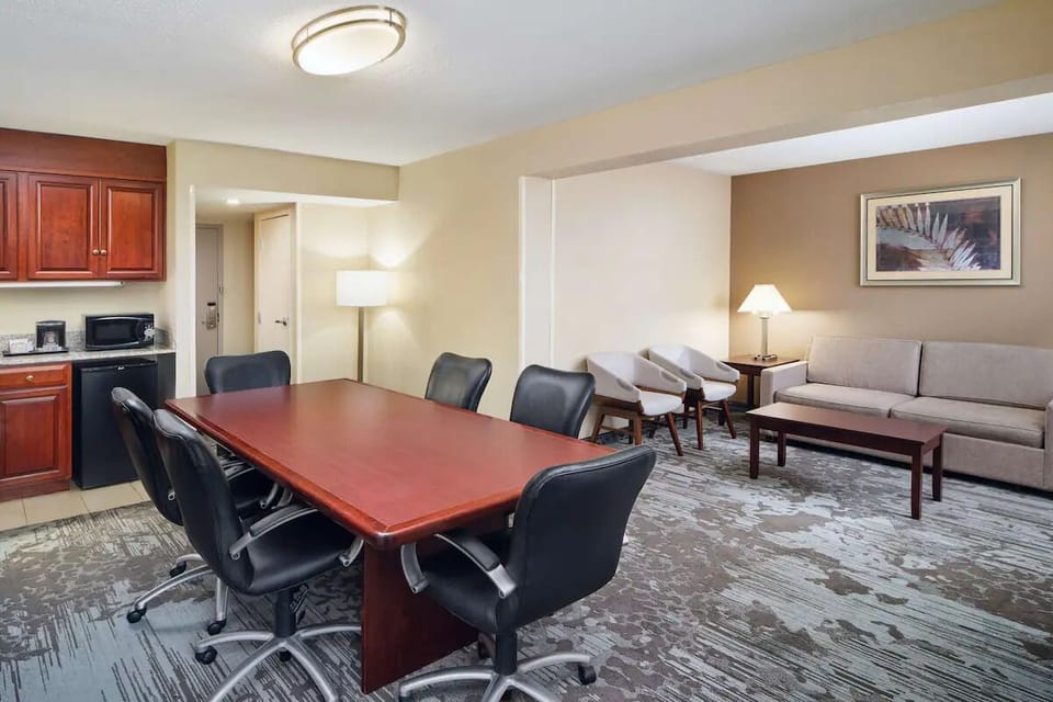 Gather comfortably around the table with space to relax.
