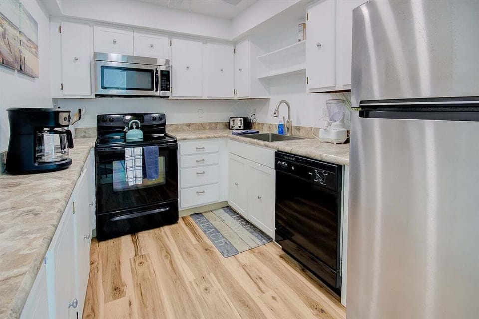 Full kitchen with stainless steel appliances