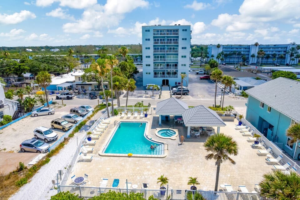 San Remo Resort pool area. Heated pool and Hot tub. Covered outdoor seating and sun lounge chairs