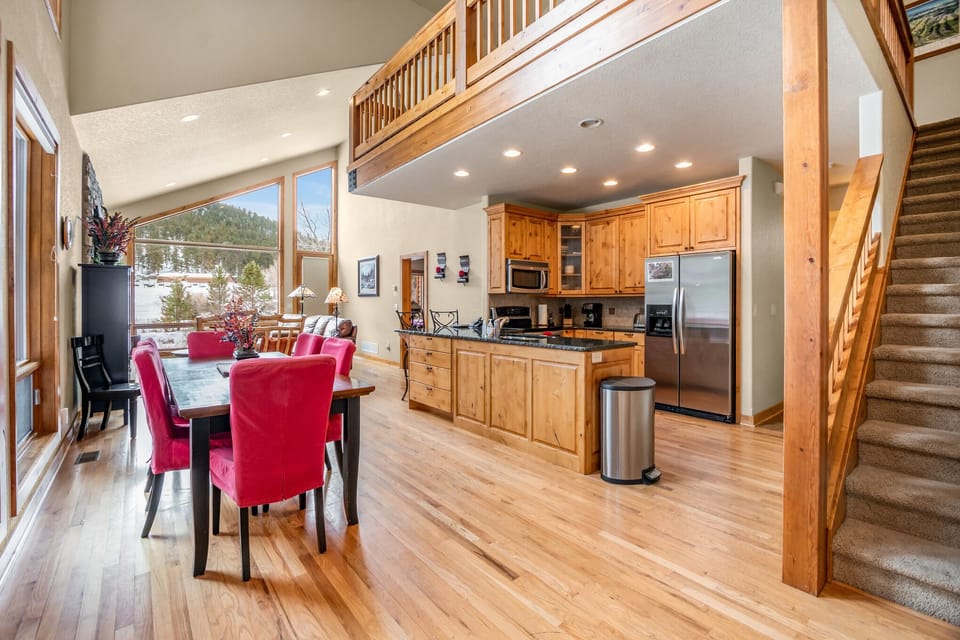 Kitchen opens into the dining area. 16 stairs to upper level