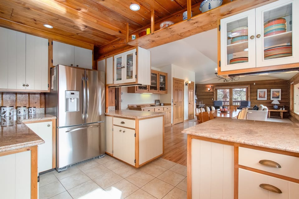 Spacious kitchen with stainless steel appliances, equipped to meet all your meal preparation needs.