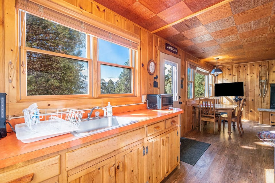 Chasm Cabin Estes Park, Kitchen sink with a window above.