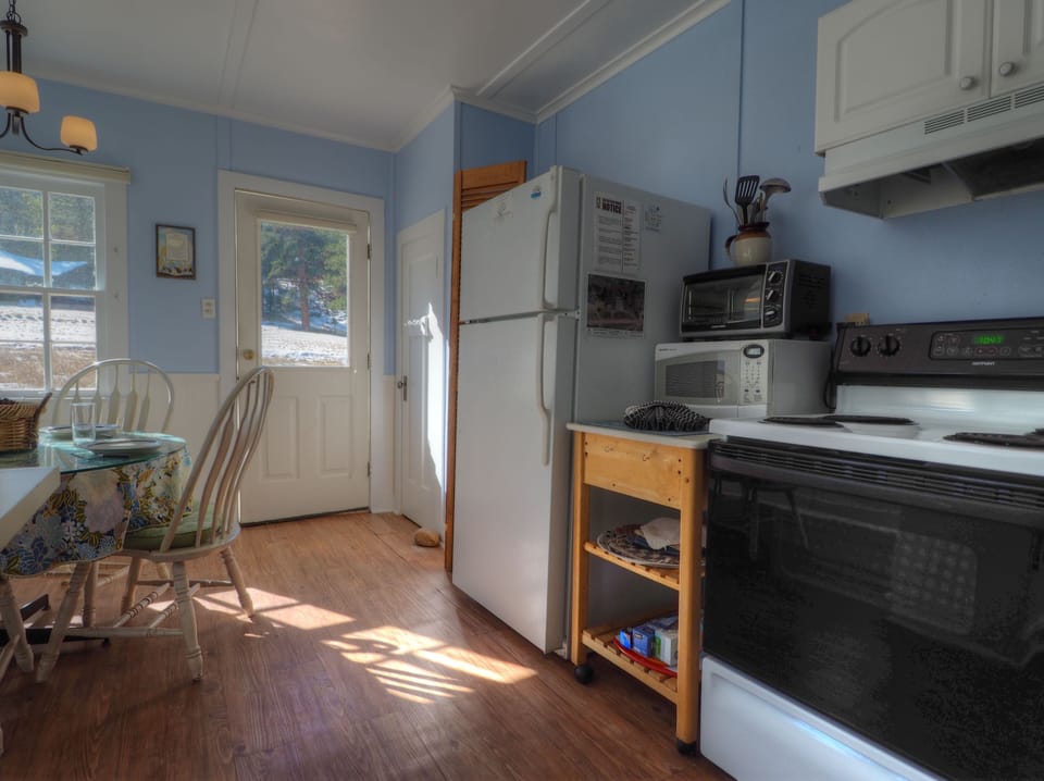 Kitchen is equipped with an oven, full size refrigerator, microwave and toaster oven 