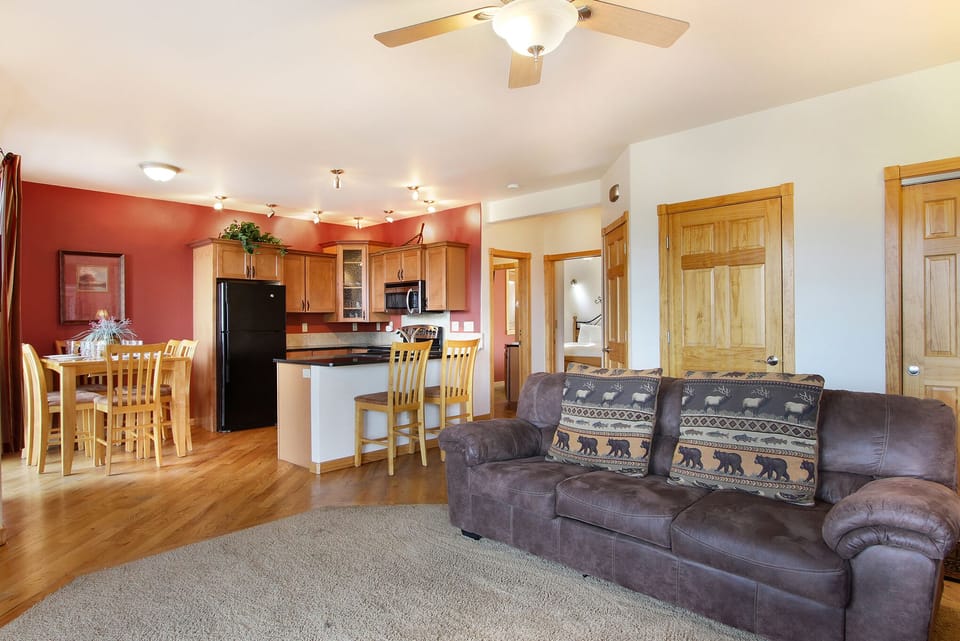 Open concept living, kitchen area.  Living room has a queen sleeper sofa. 