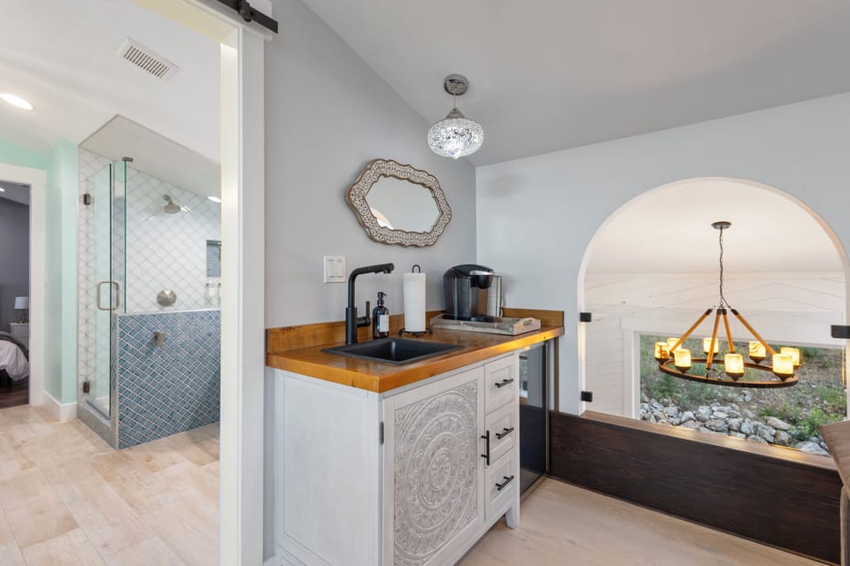 Loft kitchenette: sink, mini fridge, coffee maker, near sunroom and Bedroom #1.