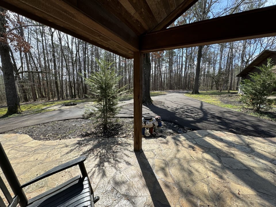 Front door view and with rocking chairs.