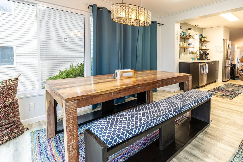 The dining table comfortably seats 8-10 guests.