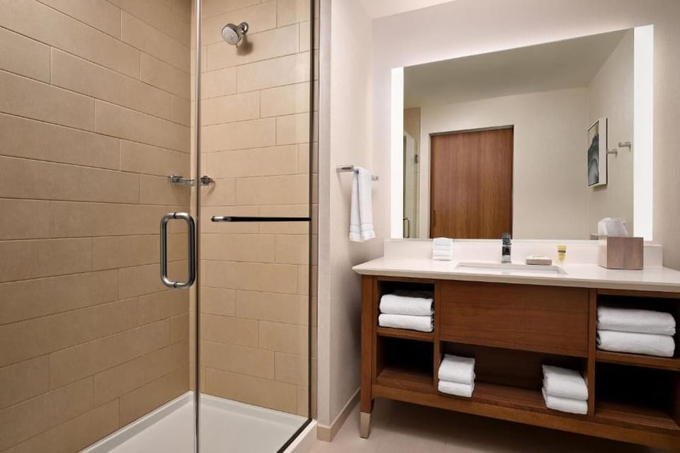 Refresh under the glass rain shower, then wrap in plush towels.
